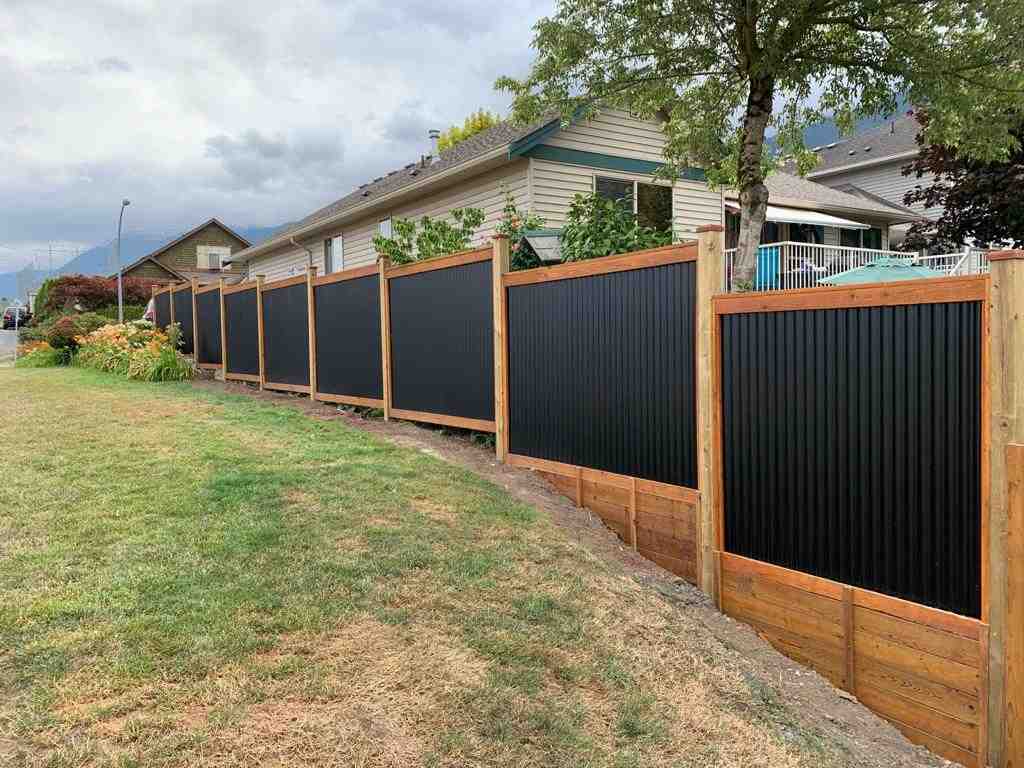 Corrugated Metal Fence With Wooden Posts