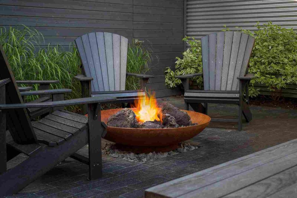 Corten Steel Fire Bowl On A Concrete Slab Patio