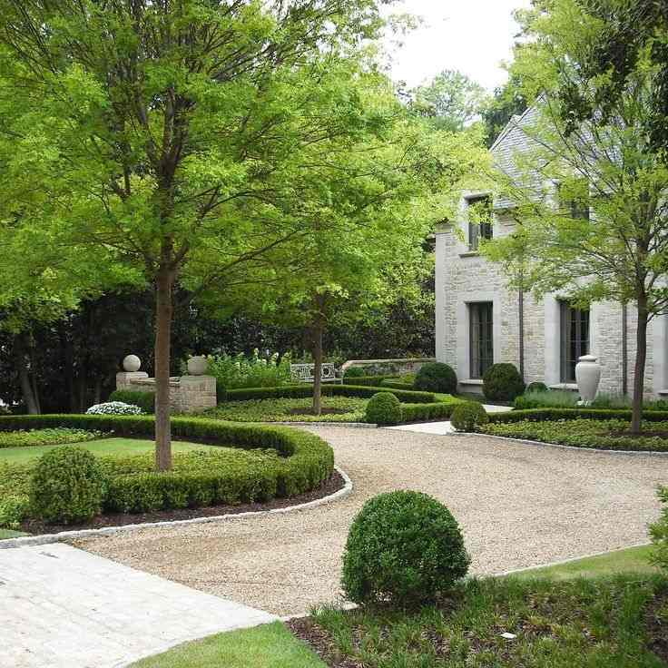 Crushed Stone Driveway With Boxwood Shrubs